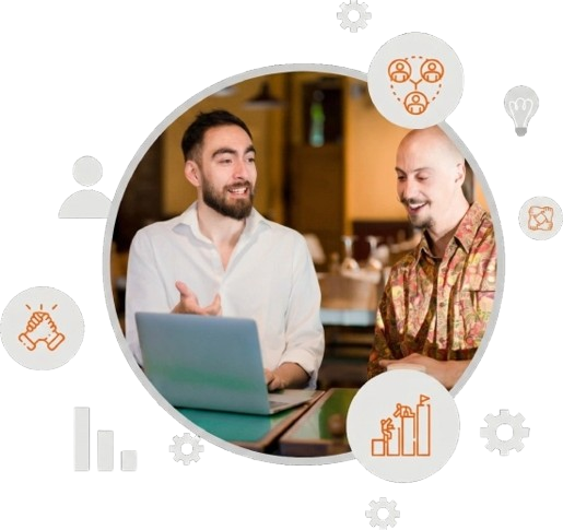 Two professionals discussing a digital marketing strategy on a computer screen
